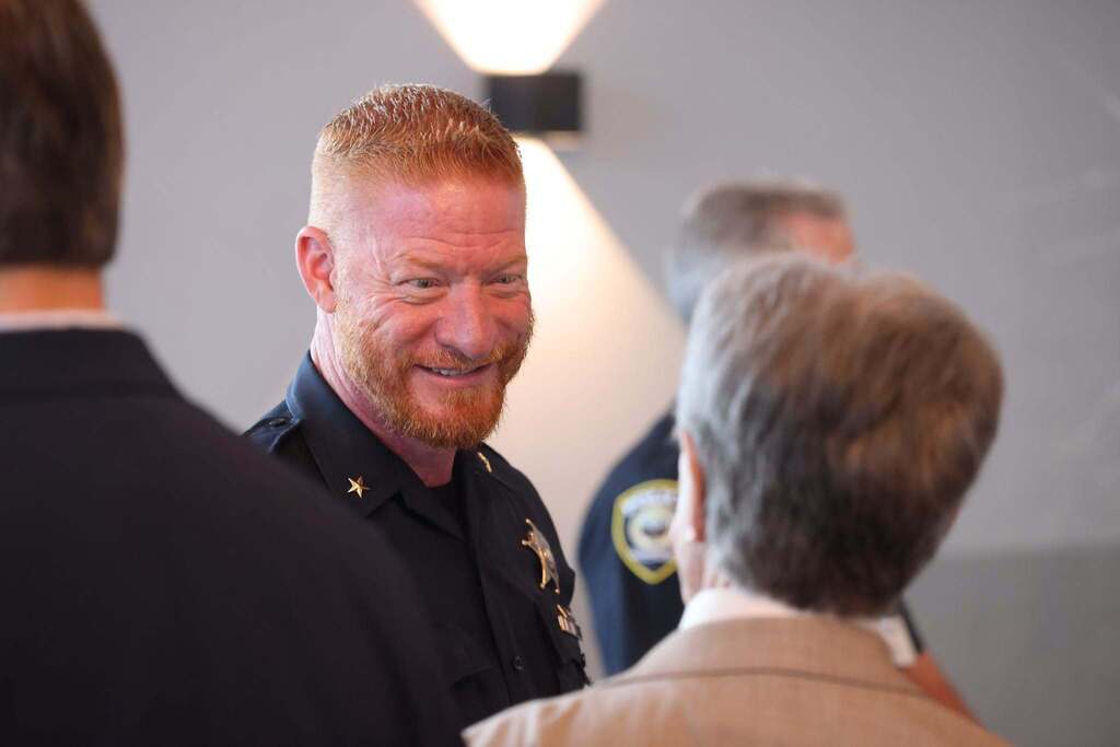 The Sheriff shaking hand with a community member.