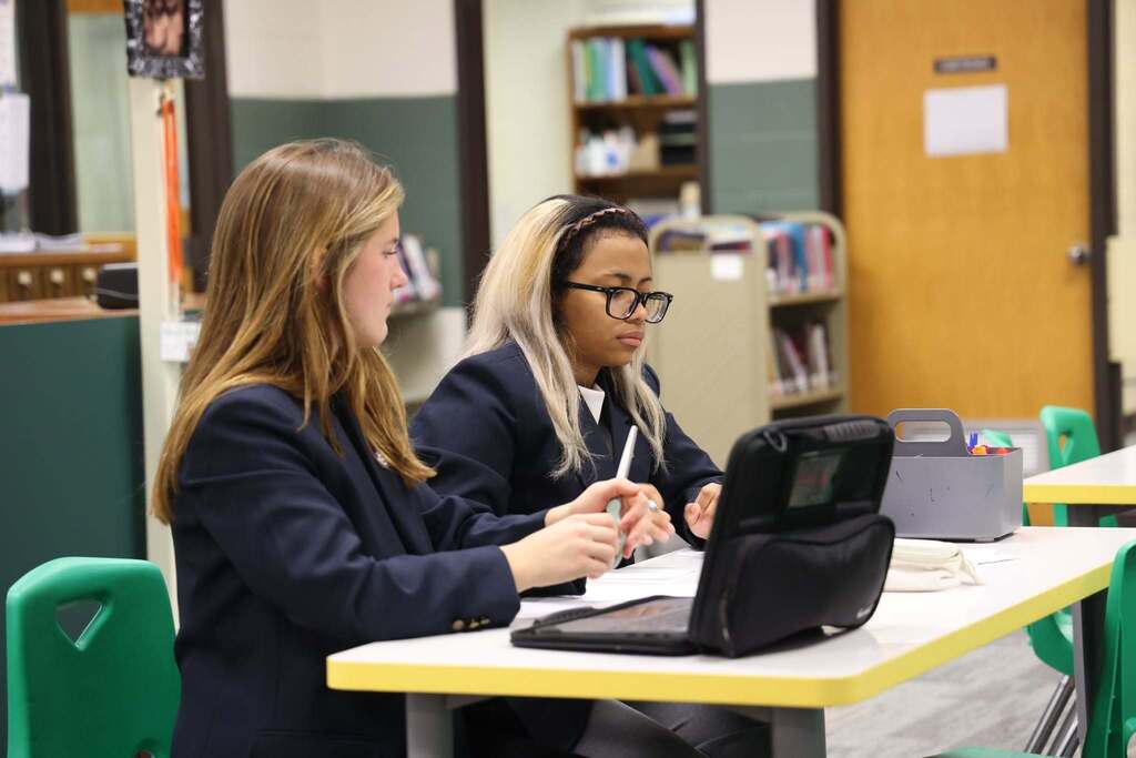 DECA Students concentrate as they prepare for the conference