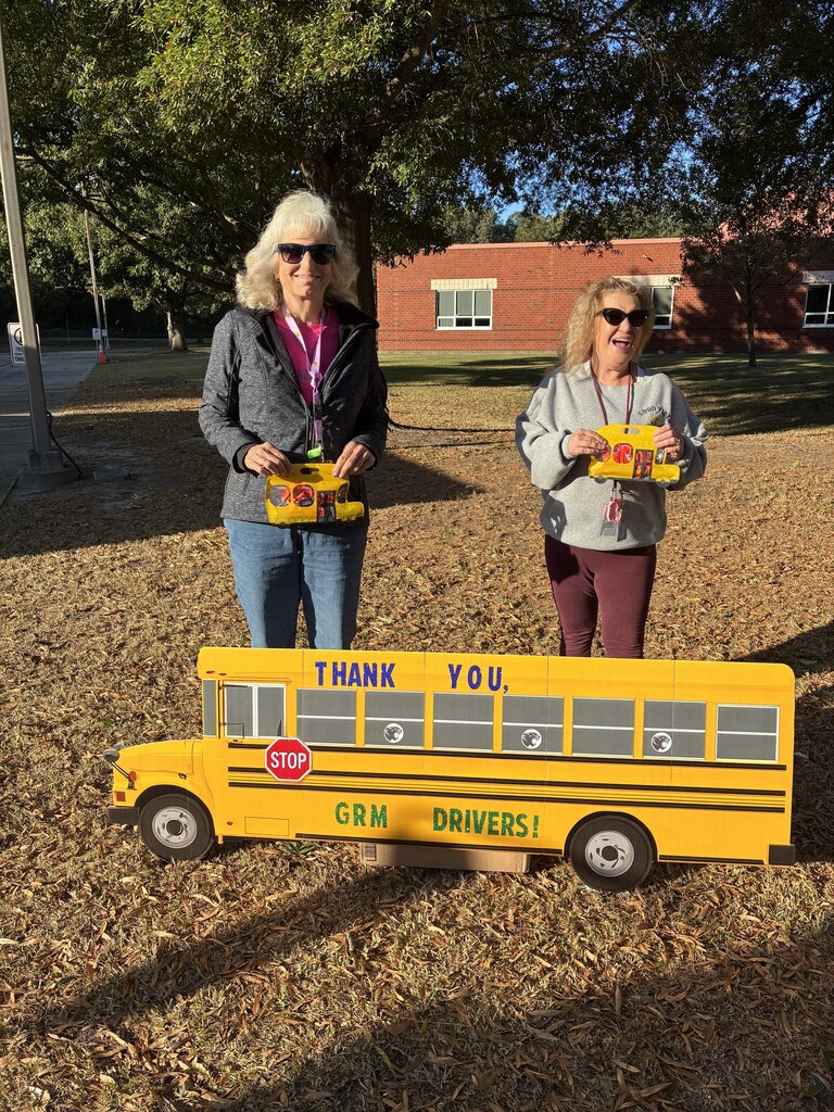 GRM Bus Drivers posee with a decorated bus