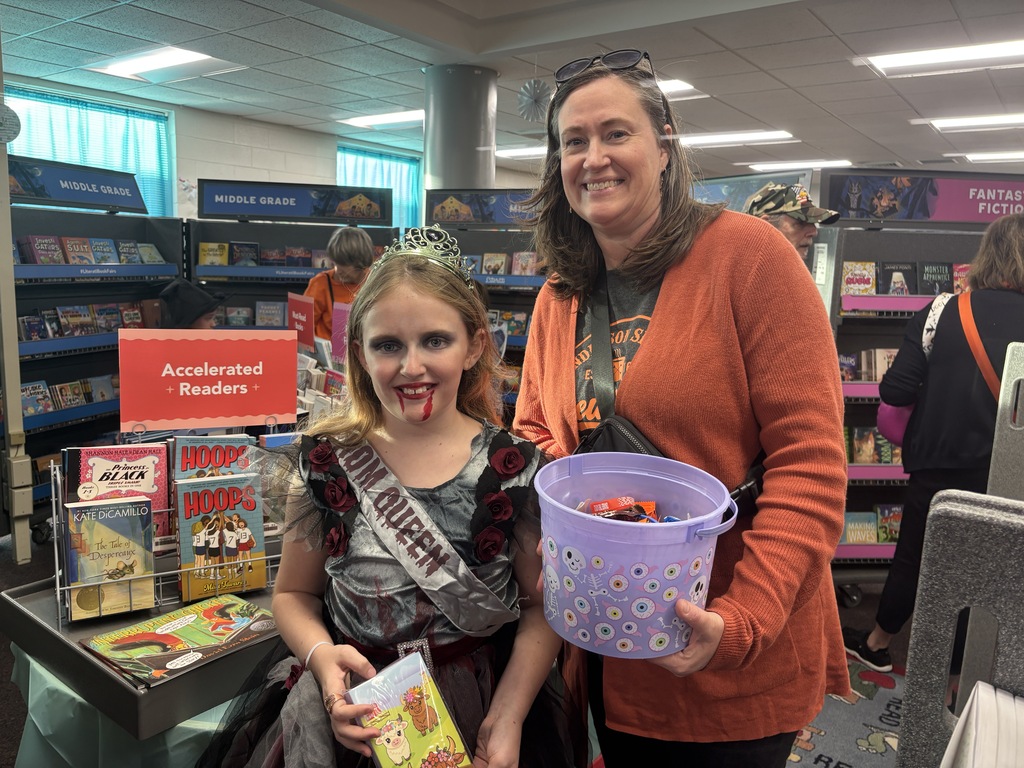 BRI families and students celebrate the first-ever Spooky Hall Crawl with Halloween costumes, trick-or-treating, candy, and fun throughout the school hallways.