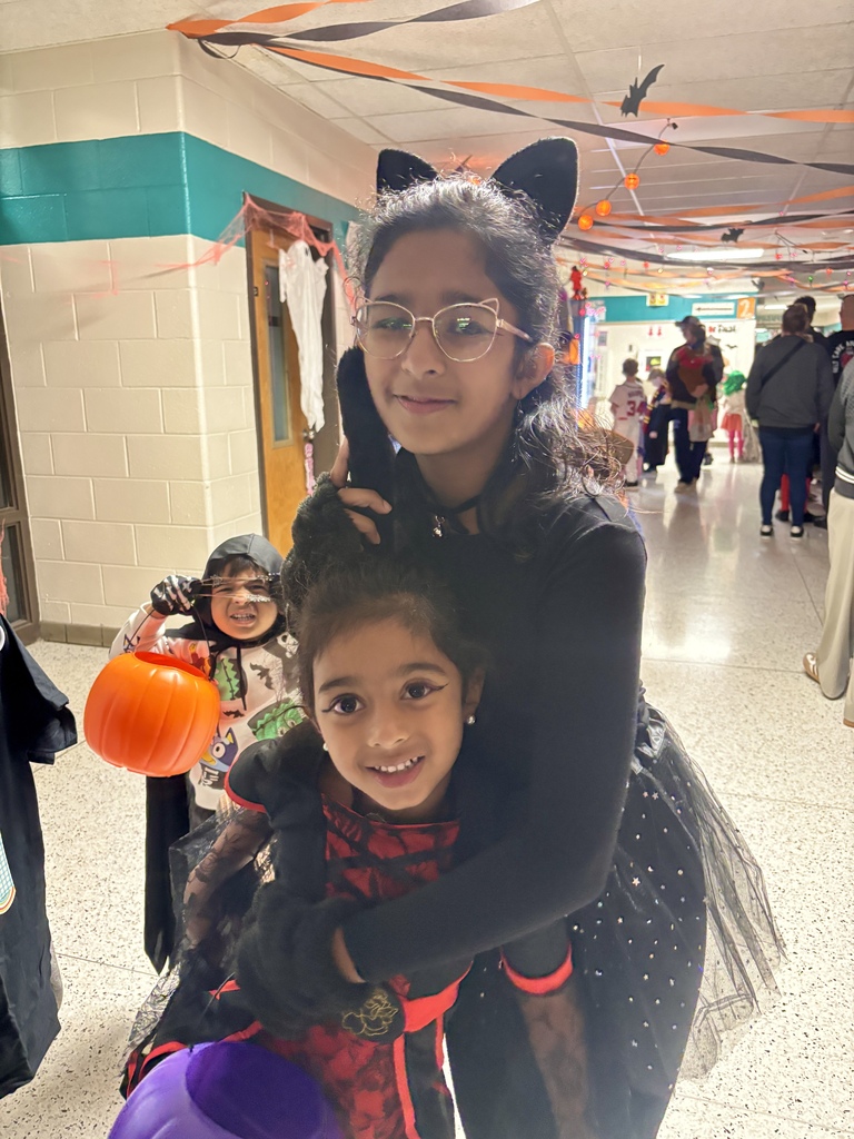 BRI families and students celebrate the first-ever Spooky Hall Crawl with Halloween costumes, trick-or-treating, candy, and fun throughout the school hallways.