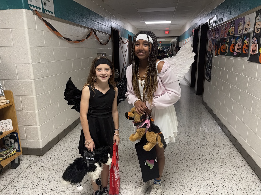 BRI families and students celebrate the first-ever Spooky Hall Crawl with Halloween costumes, trick-or-treating, candy, and fun throughout the school hallways.