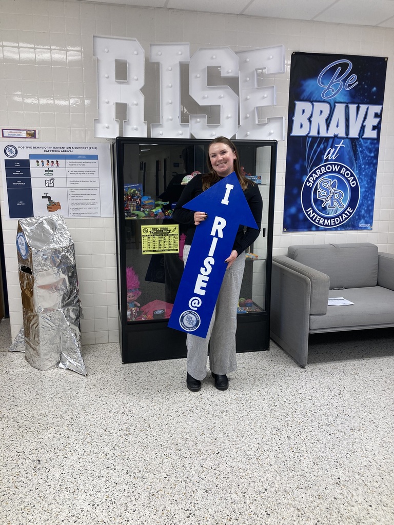 Ms. Williams' holding the RISE arrow.