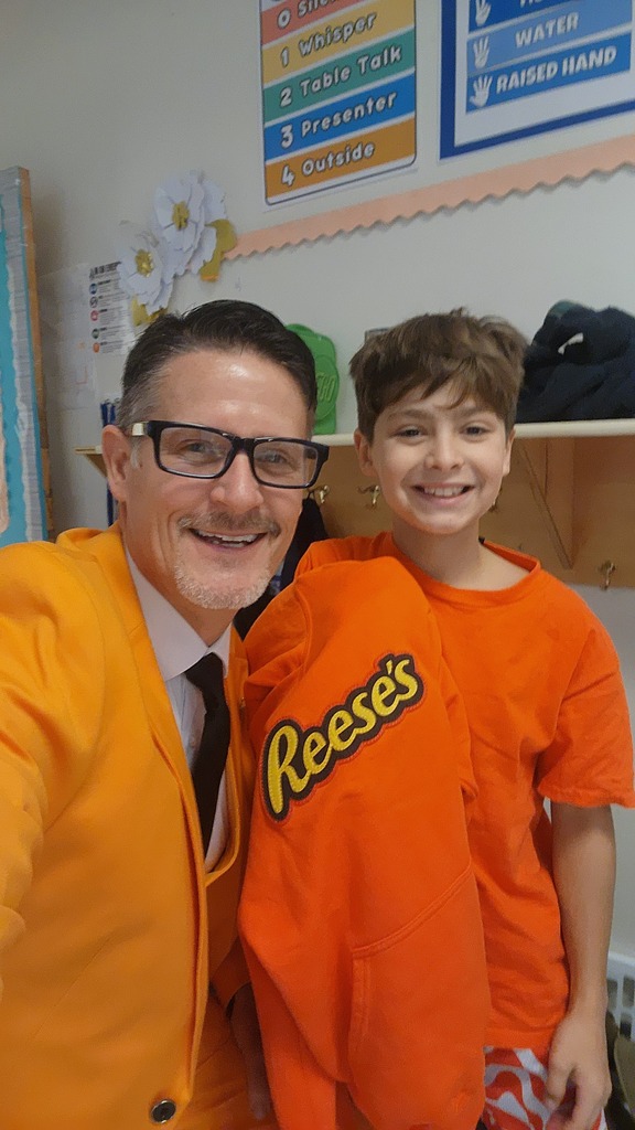 Mr. Triolet and a student in orange for Unity Day.