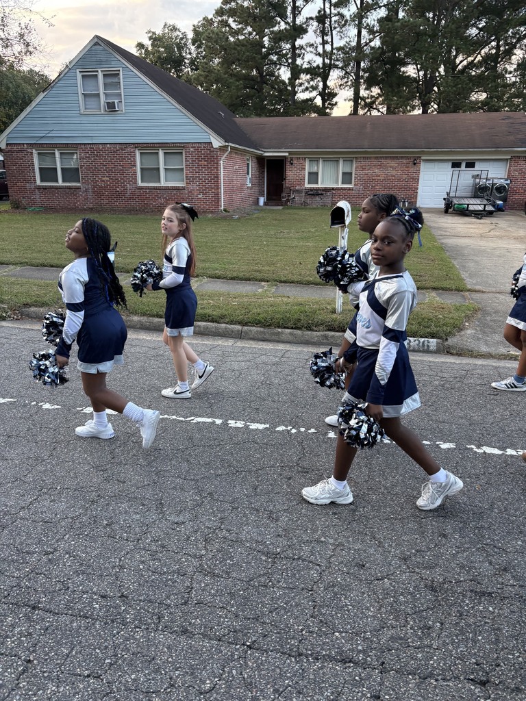 SRI Cheerleaders walking the parade.