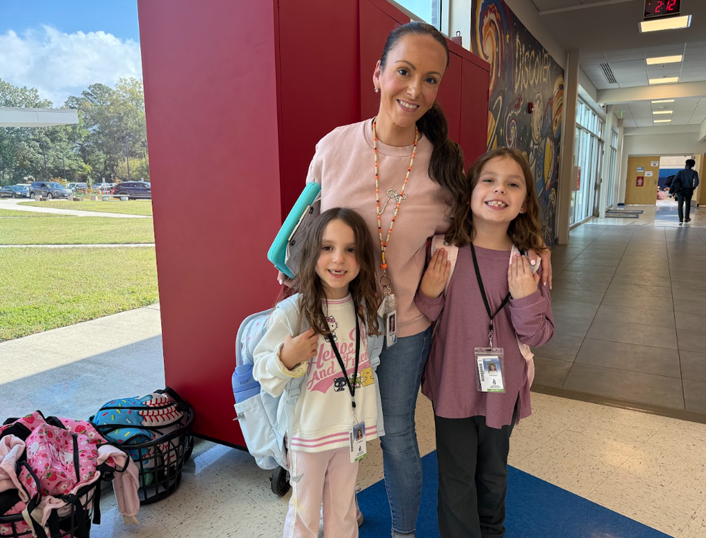 Breast cancer awareness, teacher and students posing in their pink!