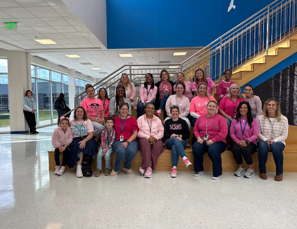 Teachers posing in their pink
