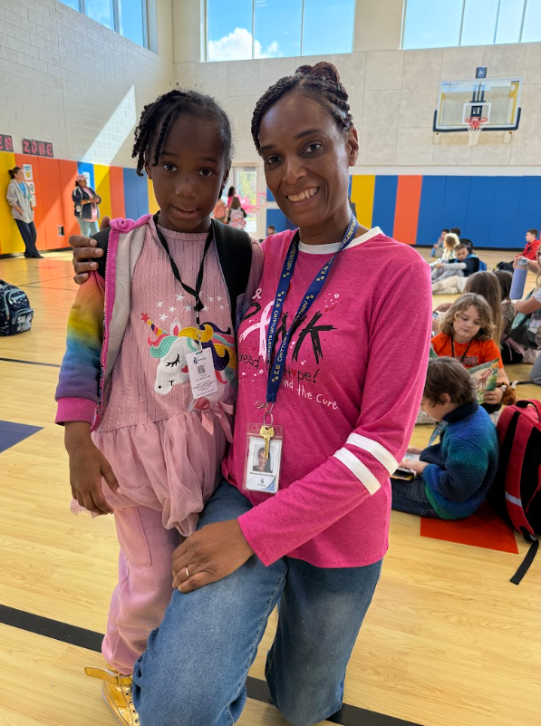 Breast cancer awareness, teacher and student posing in their pink!