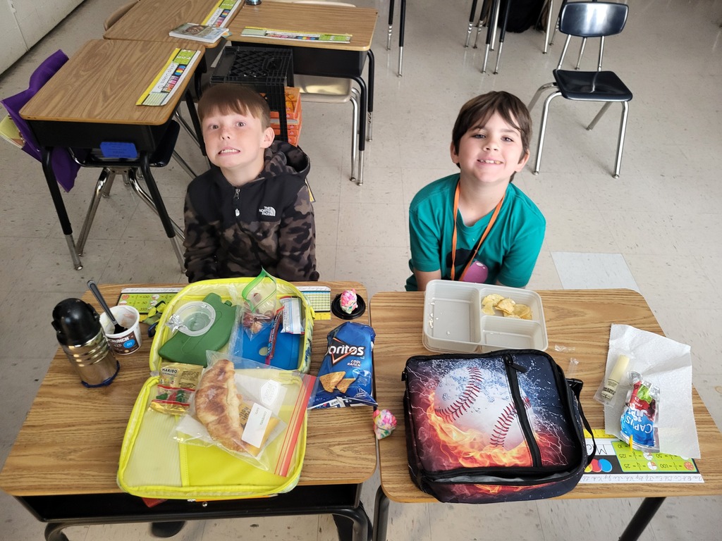 Boys eating lunch in the classroom