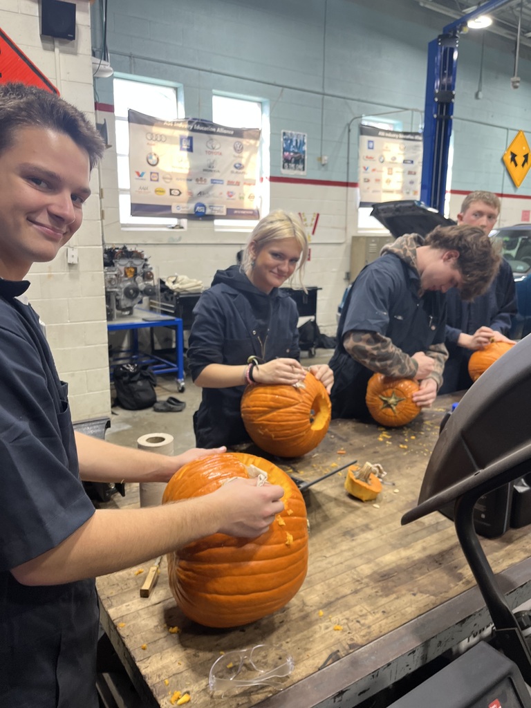 Students carving their pumpkins