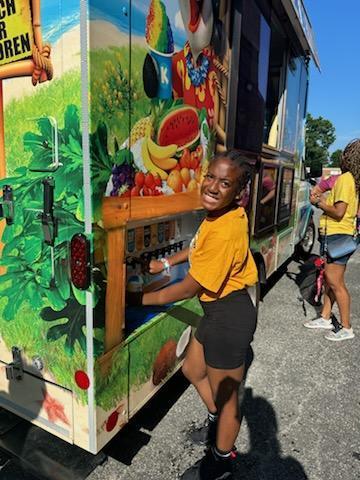 student getting kona ice