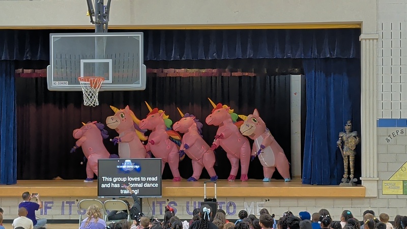 costumed staff members on stage