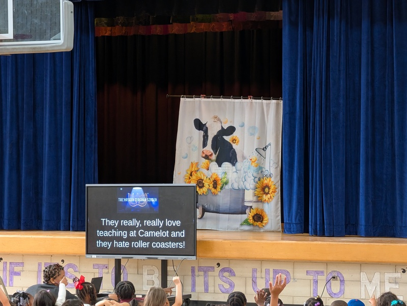 costumed staff members on stage
