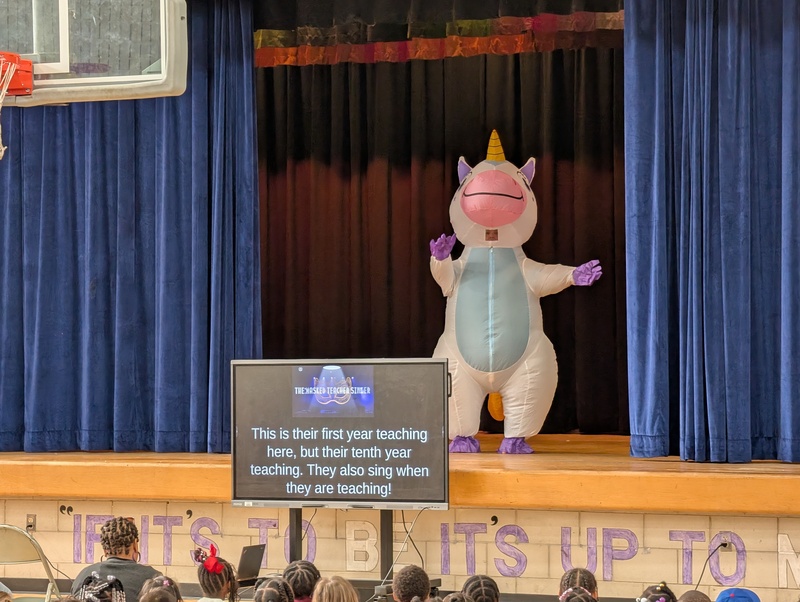 costumed staff members on stage
