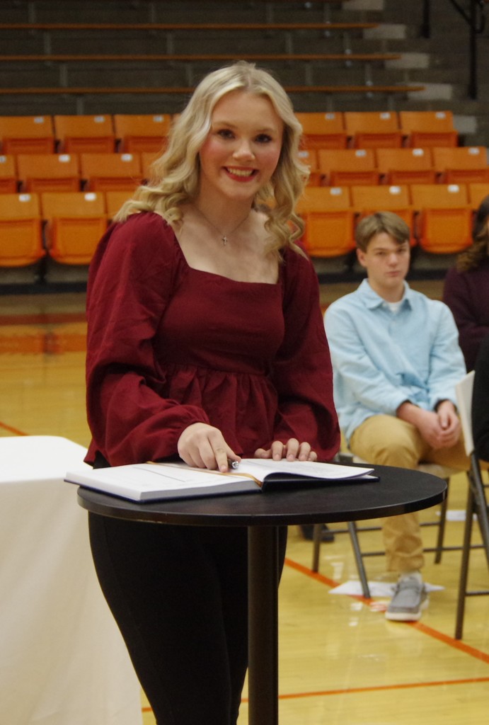 PHOTO 12 NHS Annah Helvey Ahring signs register
