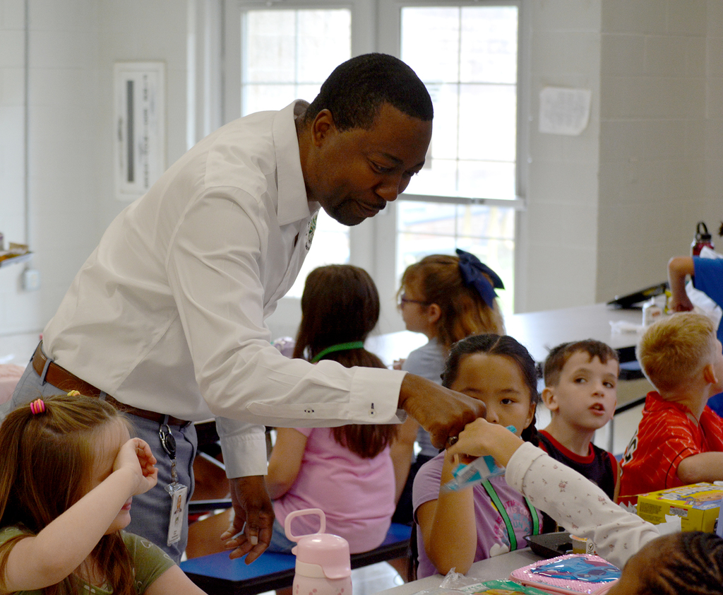 CCSD first day 2025 - Dr. Sutton and students at lunch