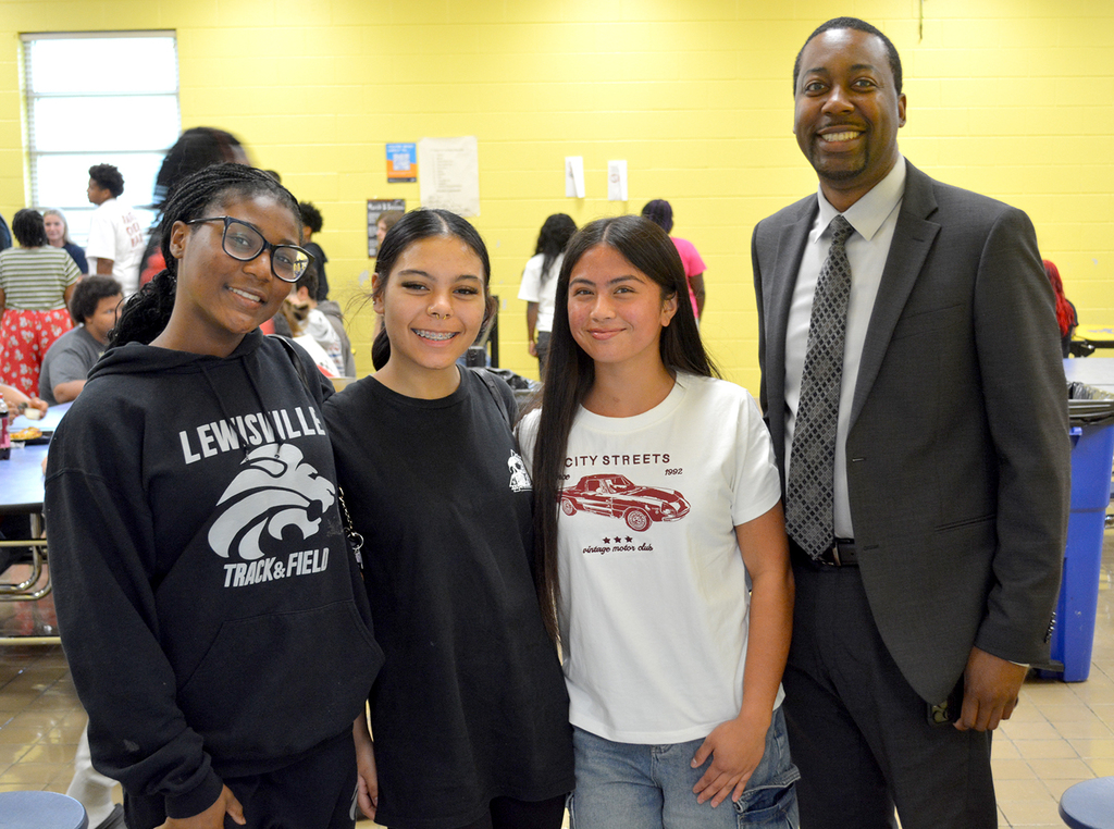 LHS, Dr Sutton visiting students.