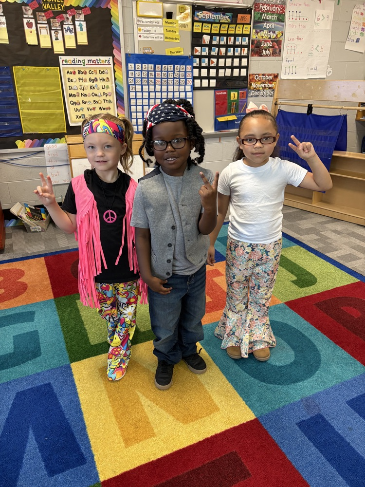 Students and staff dressed as hippies.  