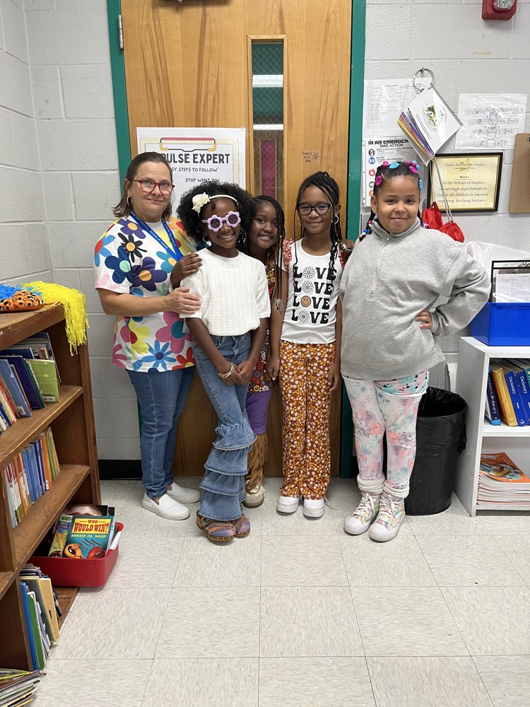 Students and staff dressed as hippies.  