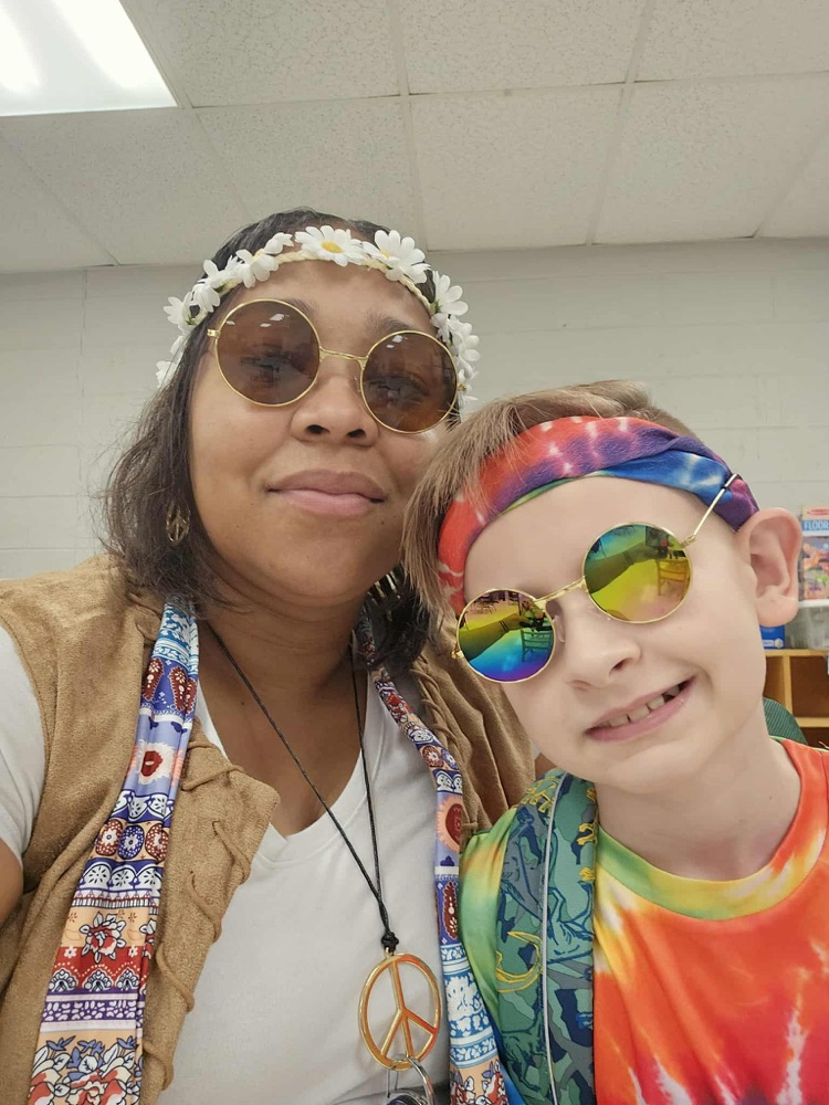 Students and staff dressed as hippies.  