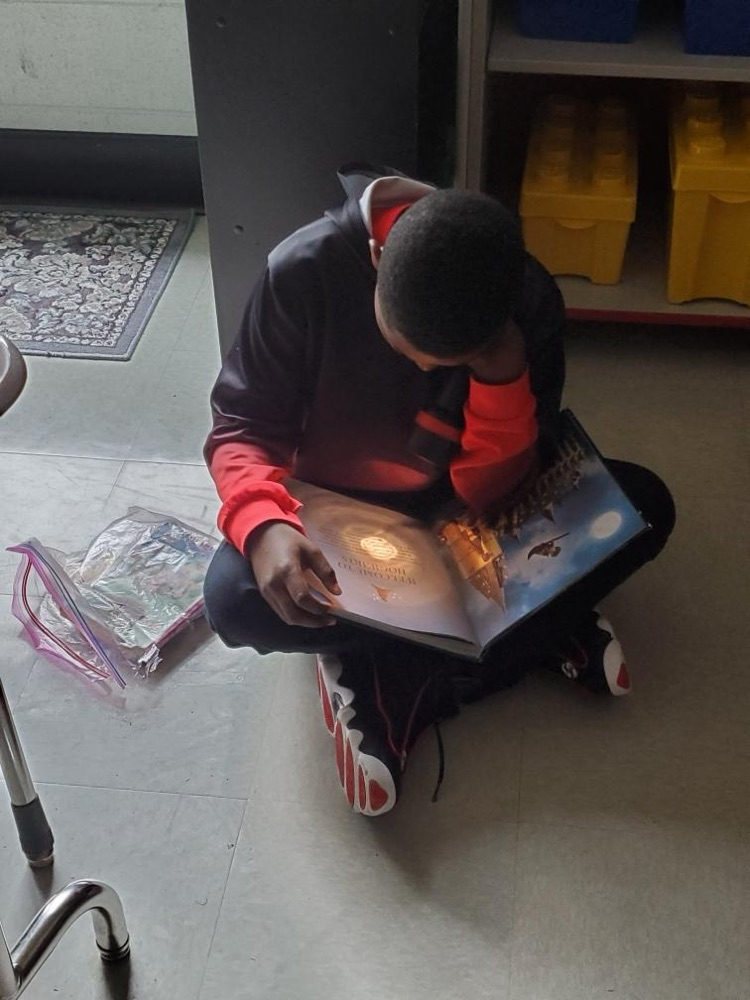 Oliver’s class used flashlights to read on Friday. 
