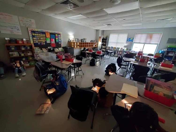 Oliver’s class used flashlights to read on Friday. 