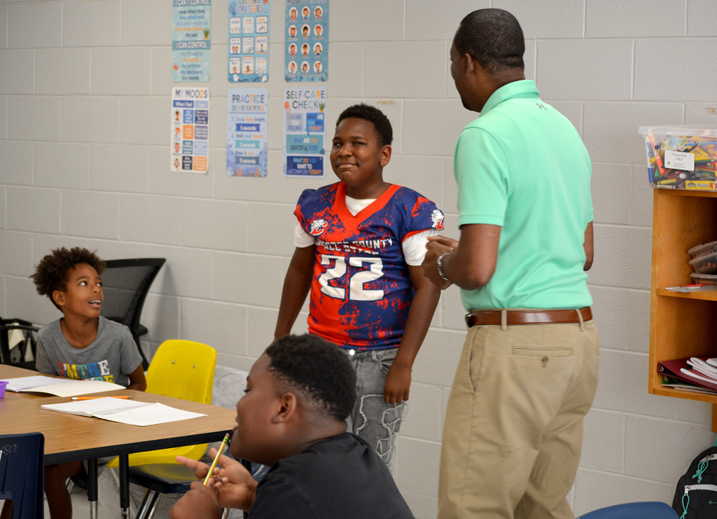 Dr. Sutton giving insight to students at Chester Park COLT.