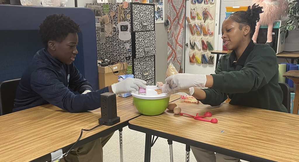 Mixing Benne wafer cookies with TLC's 8th grade students.