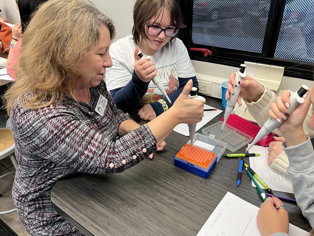Interim Superintendent Tammy Snipes and LHS students learning about forensic science.