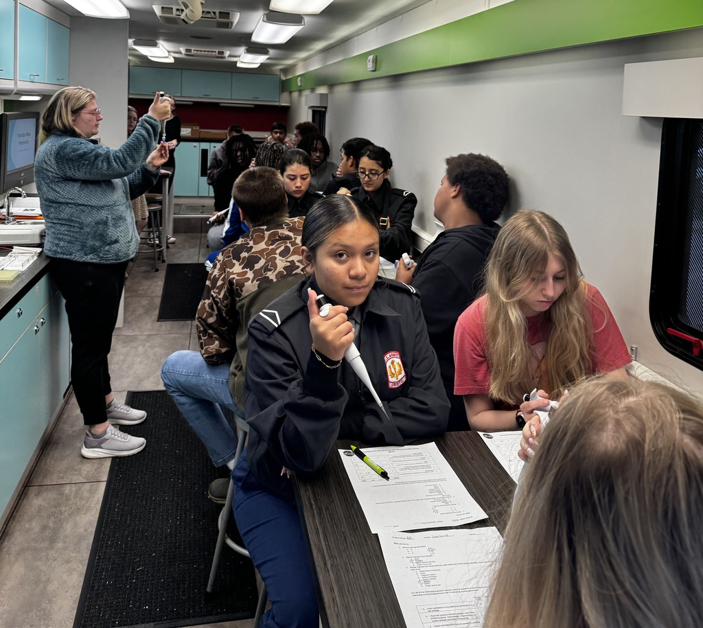 Interim Superintendent Tammy Snipes and LHS students learning about forensic science.
