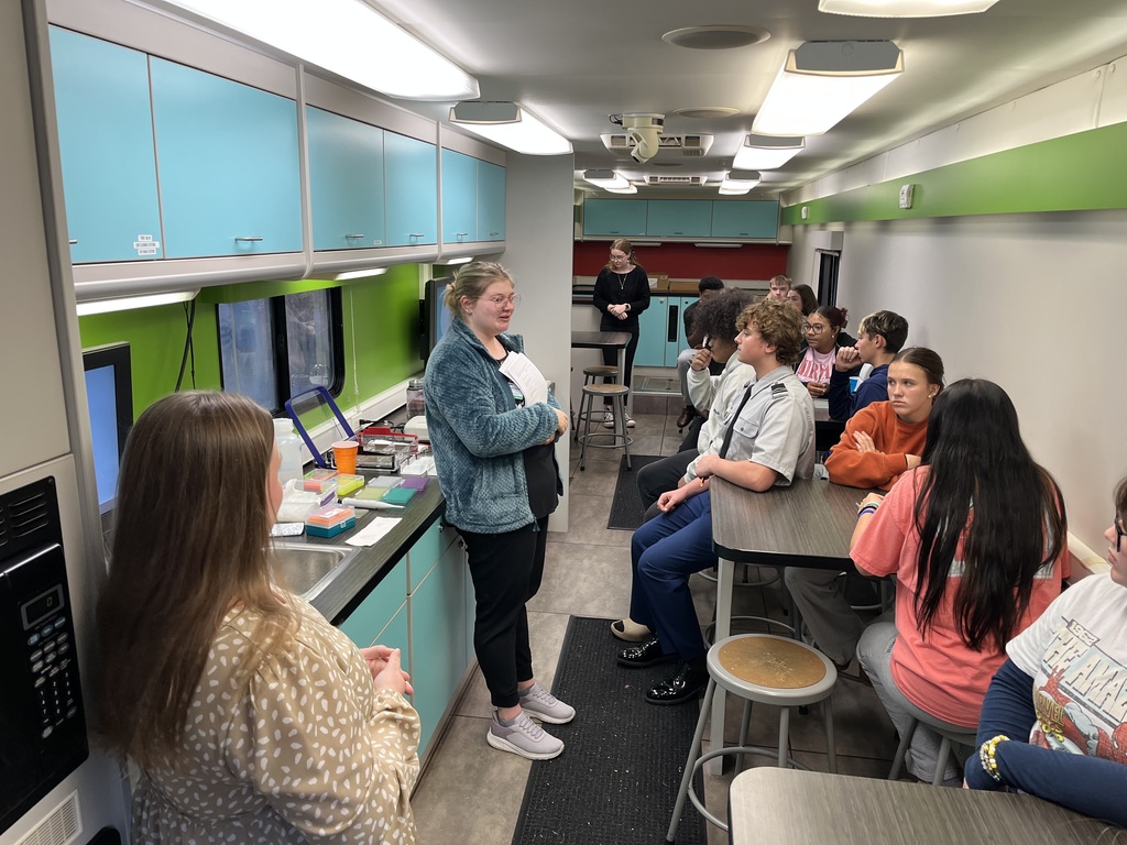 Interim Superintendent Tammy Snipes and LHS students learning about forensic science.