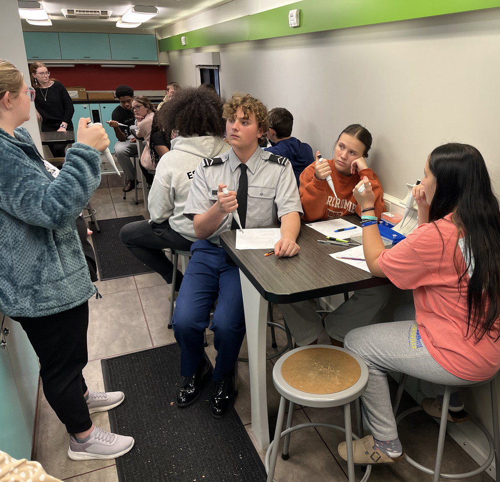 Interim Superintendent Tammy Snipes and LHS students learning about forensic science.