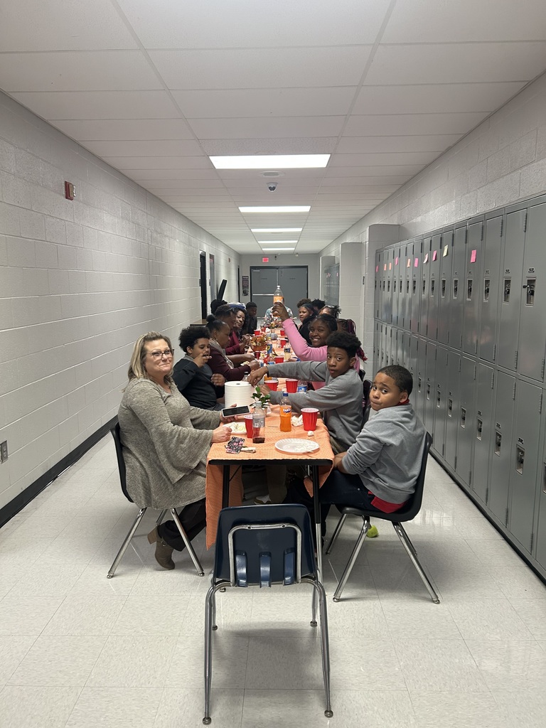 Students and staff of TLC celebrating Thanksgiving together.