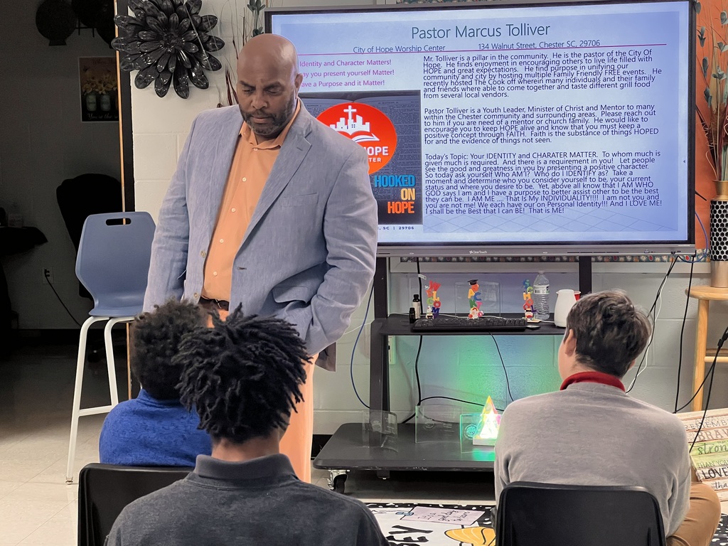 Pastor Tolliver speaking with the students of TLC.