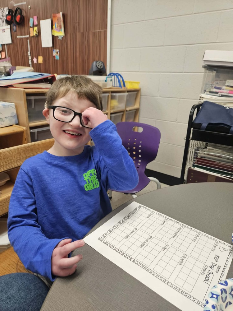 Students sorting items for the 100th day!