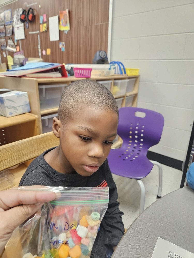 Students sorting items for the 100th day!