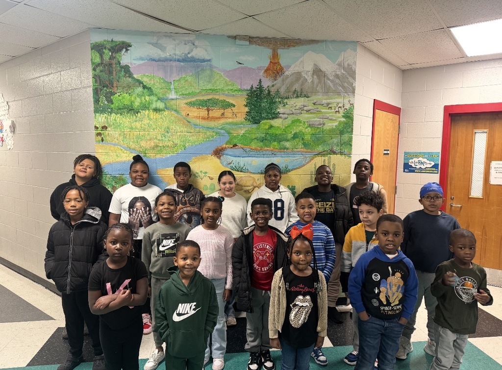 The students are posing for Star Student of the Month.