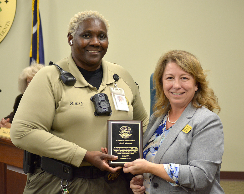 Officer Alexander receiving a commendation from Superintendent Tammy Snipes.