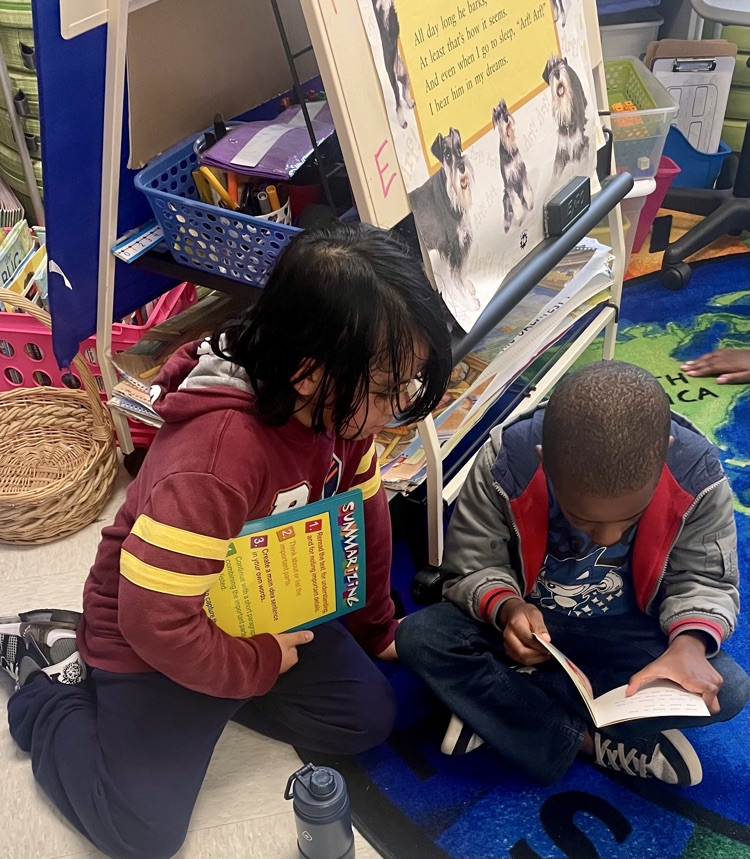The photo shows book buddies reading together.