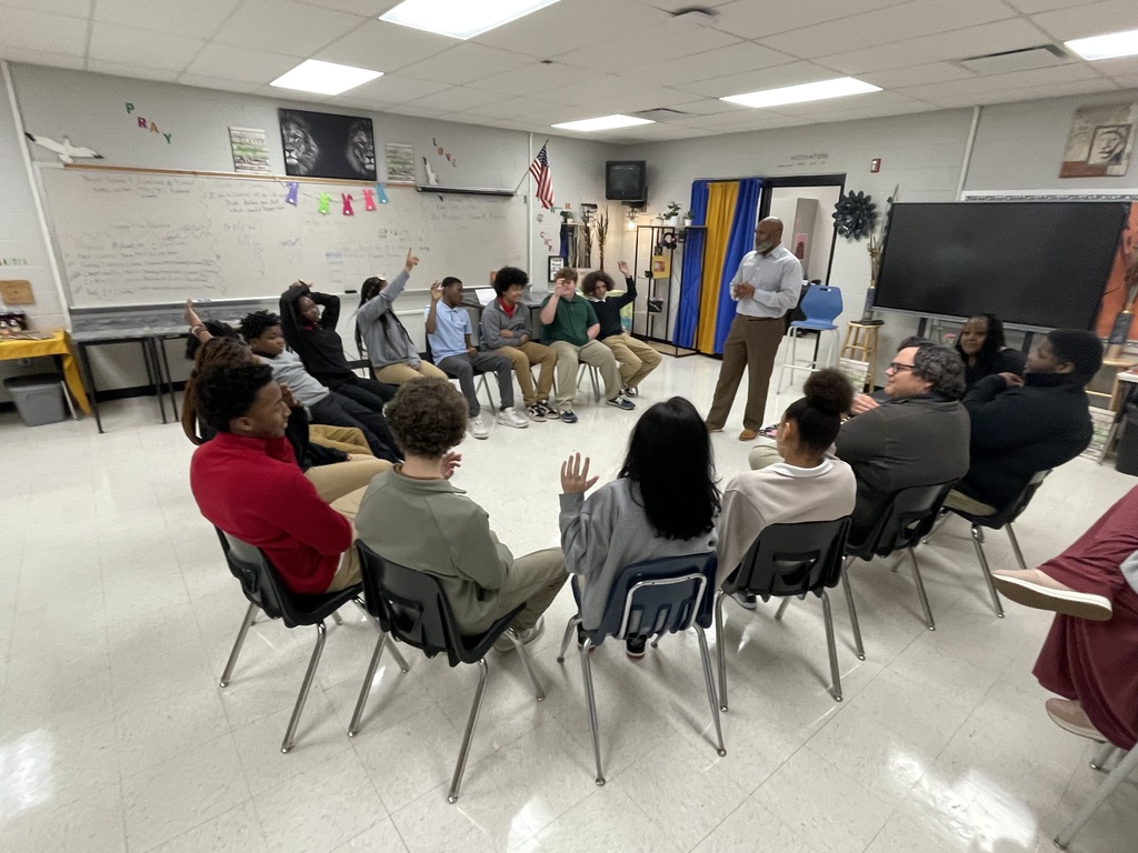 Travis Commodore speaking with TLC students