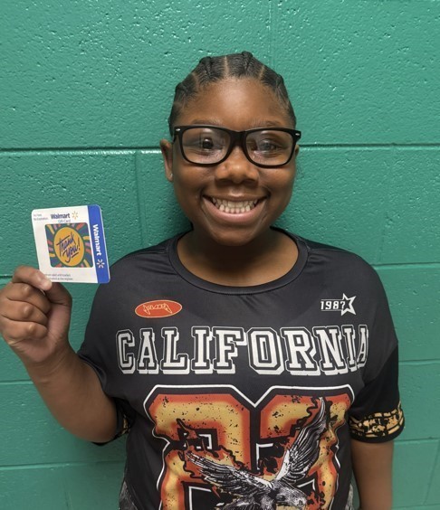 The student pictured won the random drawing for parent surveys.