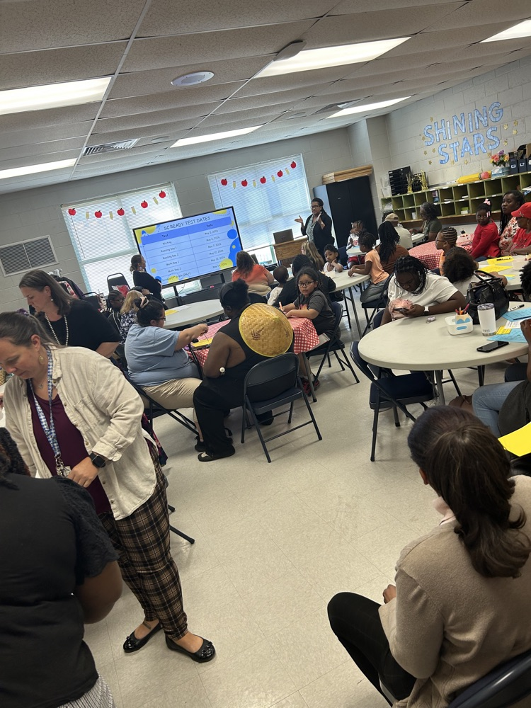 The photos show families in grades 3-5 at our family workshop  