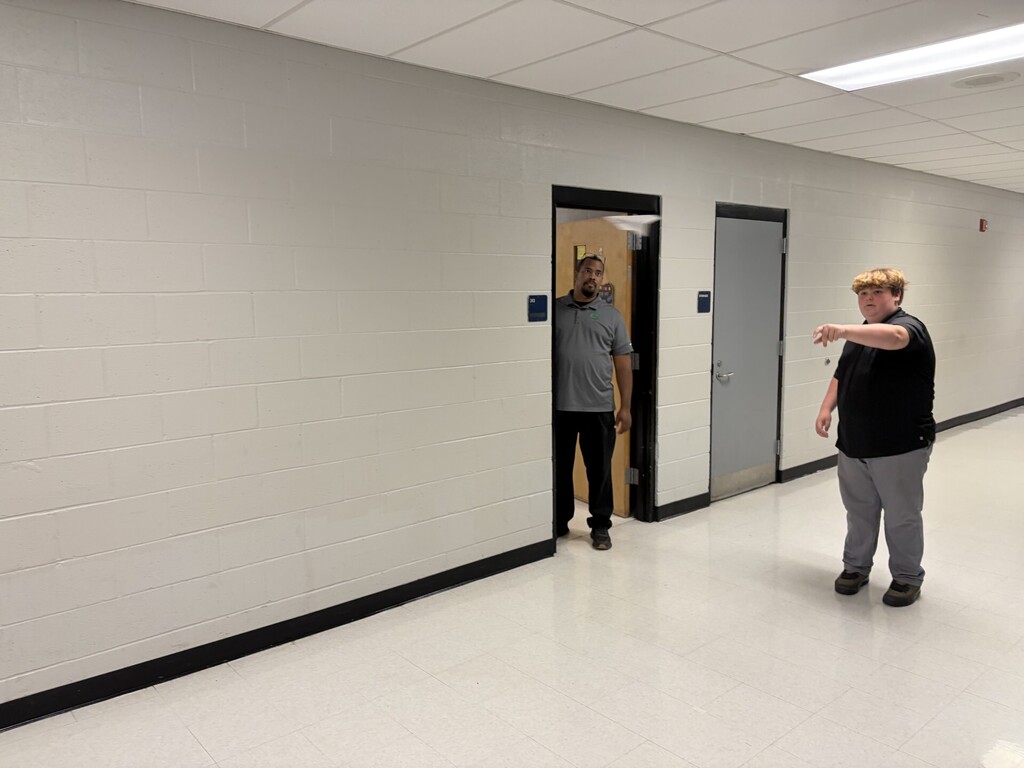 A student watching his airplane fly. 