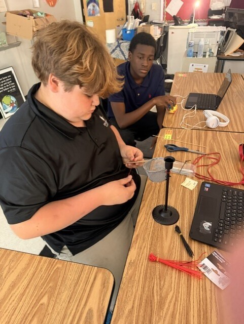 Working on the elements of their game board. 