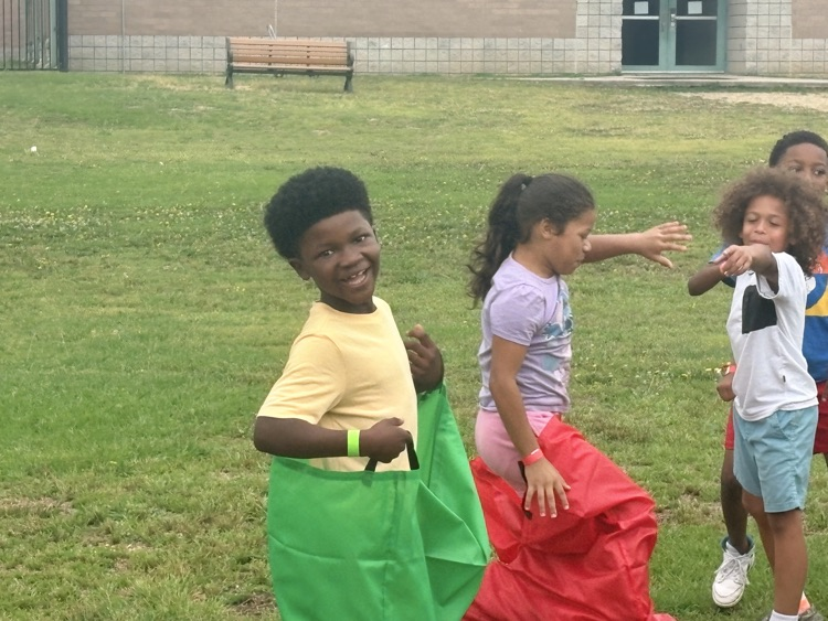Students are playing at Field Day. 