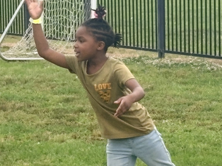 Students are playing at Field Day. 