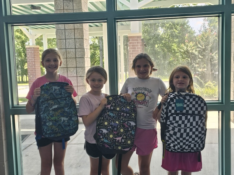 Students show off bookbags  