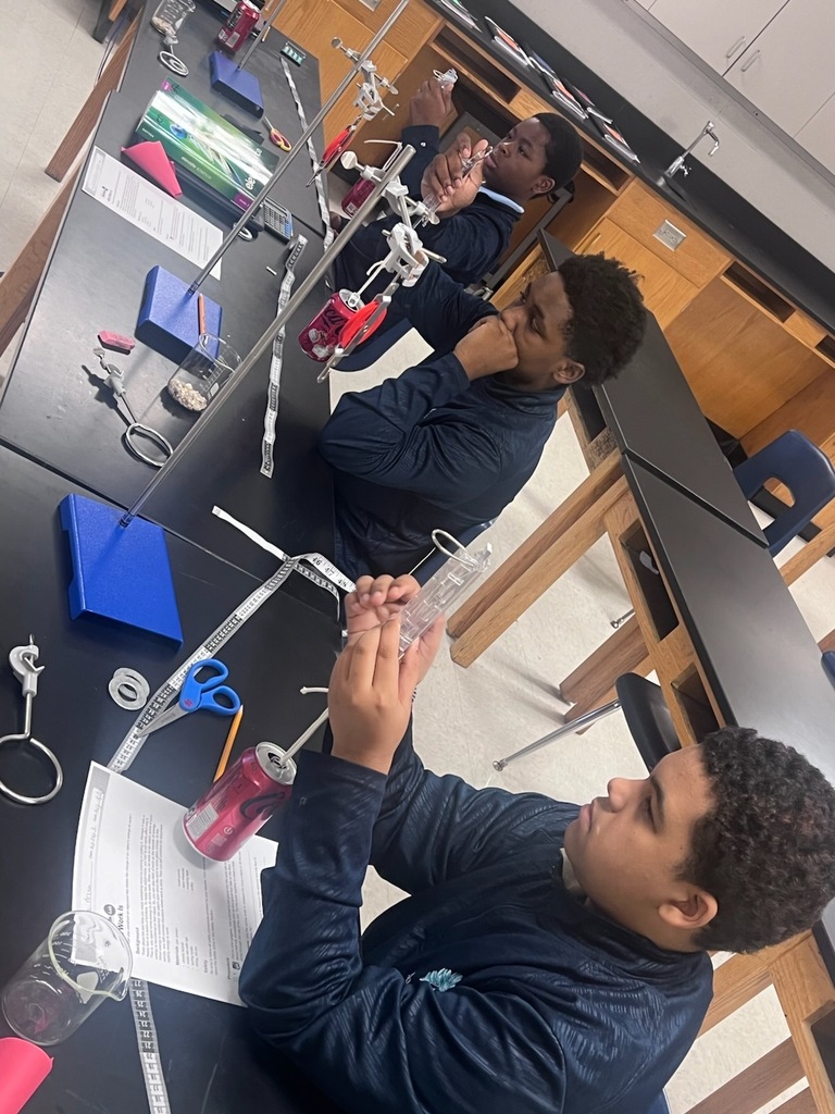 TLC students practicing with the weights and measures. 