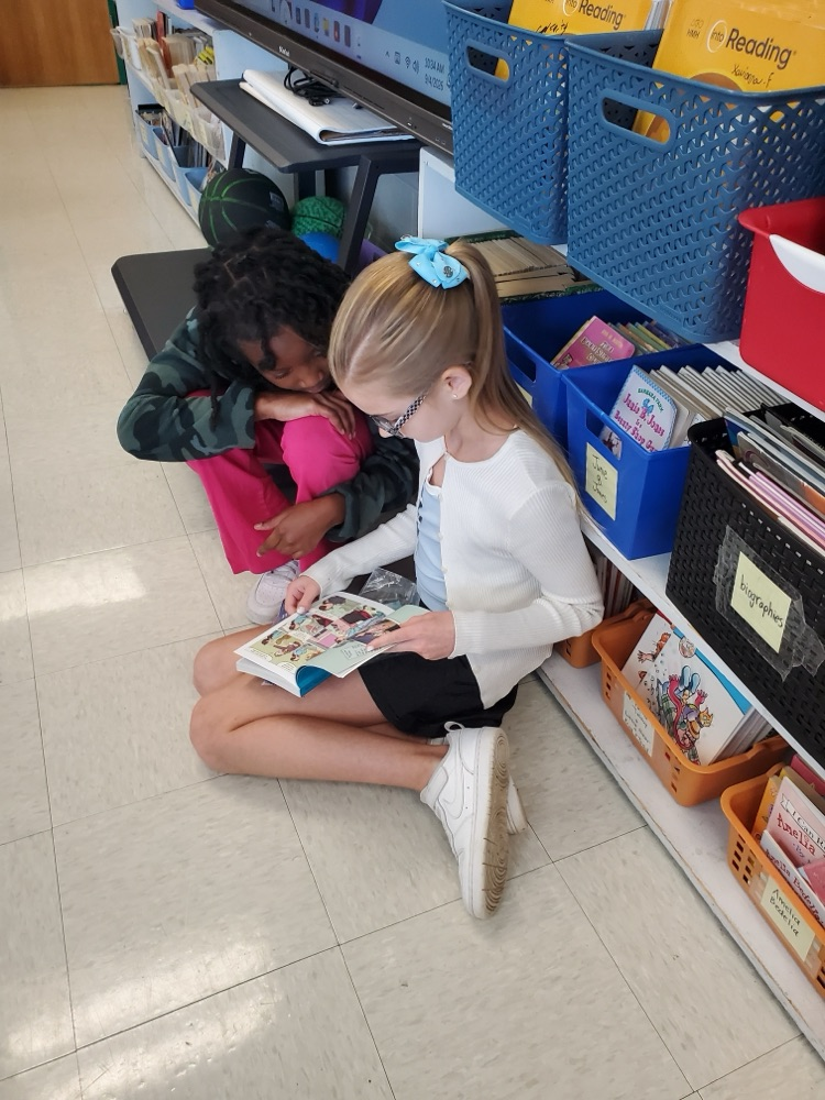 Students are partner reading. 