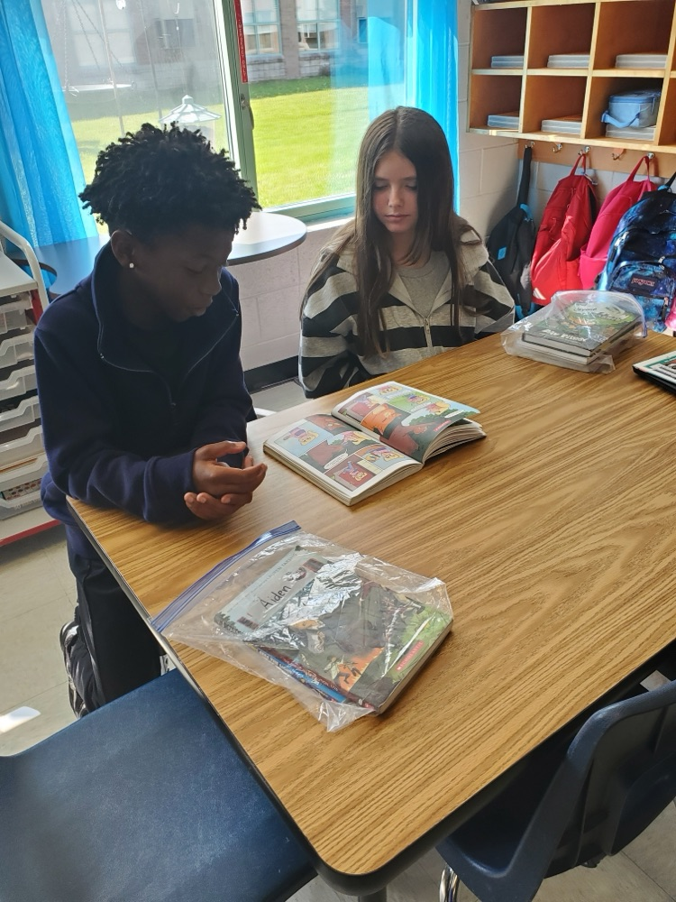 Students are partner reading. 